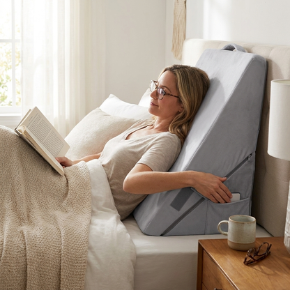 Adjustable bed wedge pillow in use on a bed