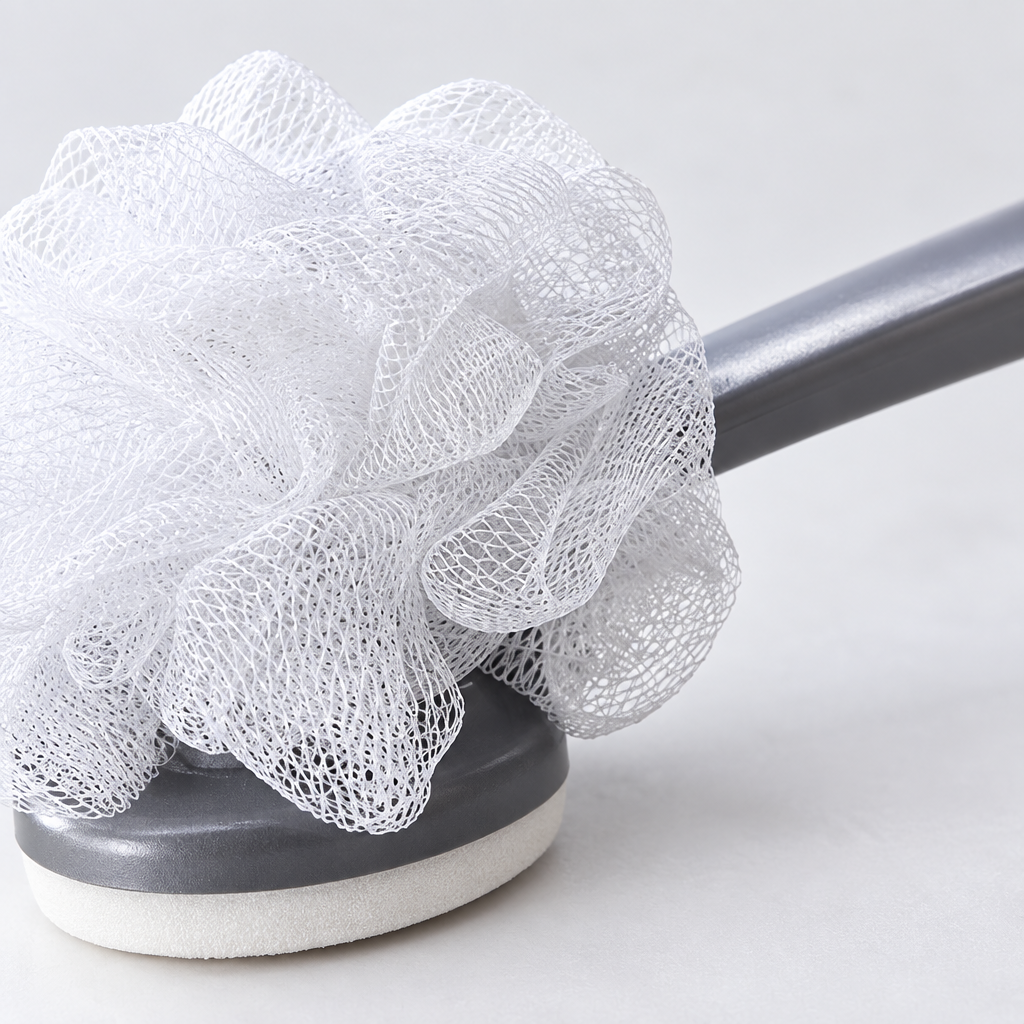 Close-up detail of the exfoliating sponge texture and handle
