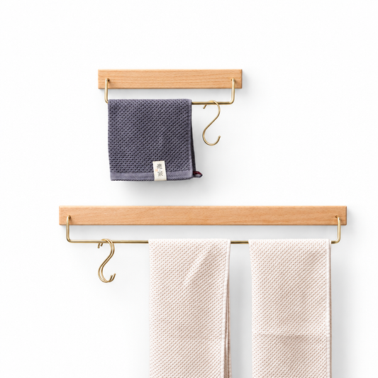 Wall hanging single pole towel bar on a white studio background