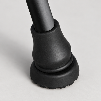Close-up detail of the black cane tip cover rubber tread