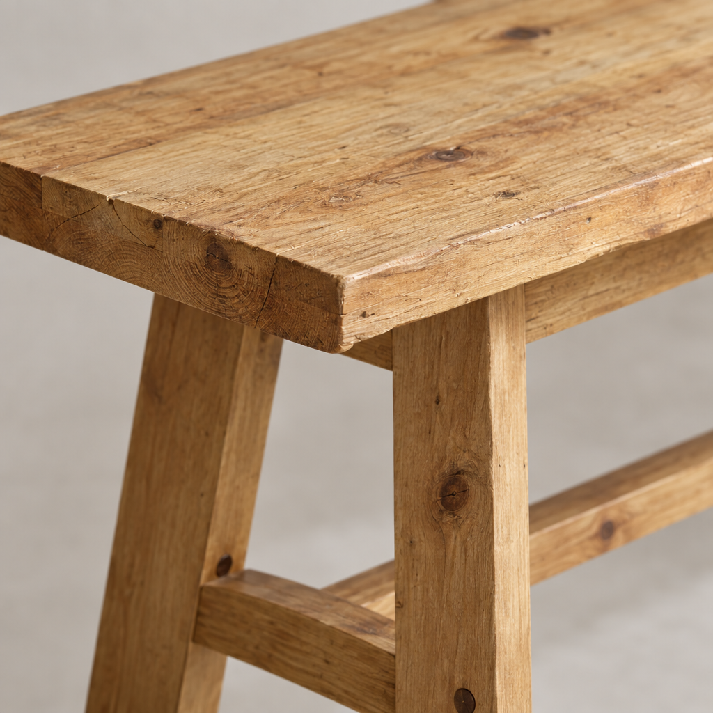 Close-up detail of the entryway bench wood grain and joinery