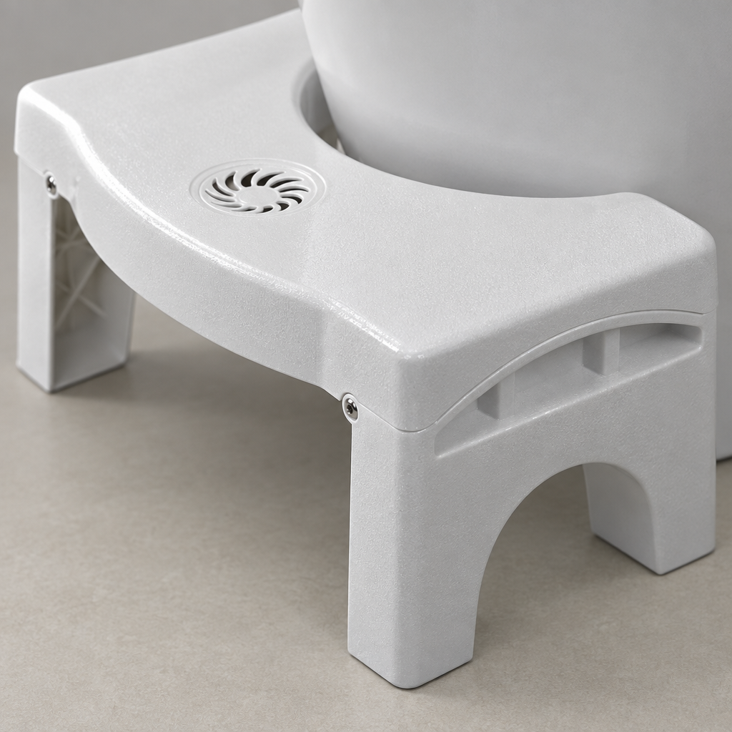 Close-up detail of the toilet step stool plastic surface and folding hinge