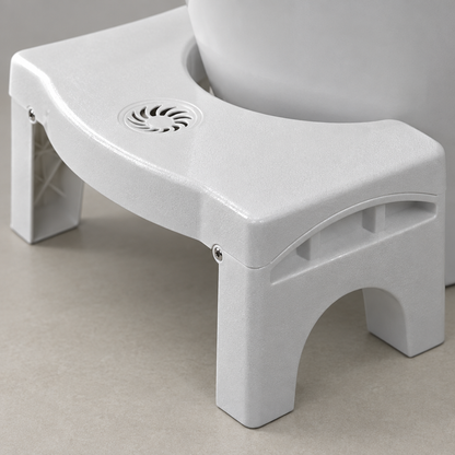 Close-up detail of the toilet step stool plastic surface and folding hinge