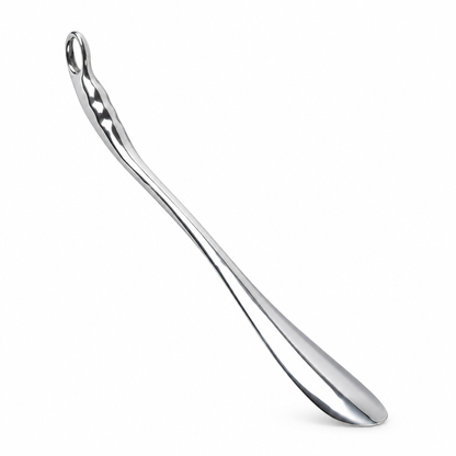 Long stainless steel metal shoe puller, studio product photo