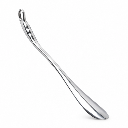 Long stainless steel metal shoe puller, studio product photo