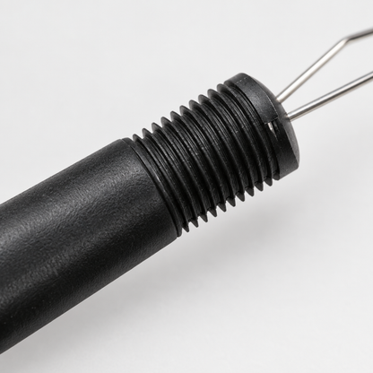 Close-up detail of the button zipper aid hook and handle